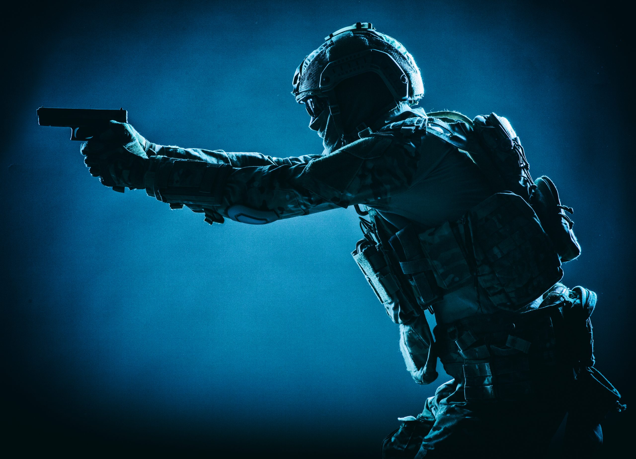 Anti terrorist squad fighter aiming with pistol
